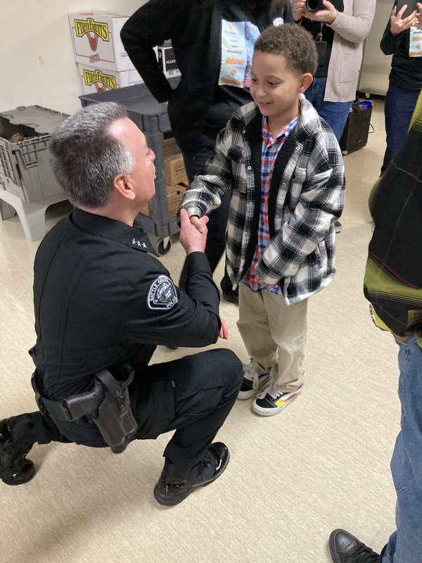 The police chief greets a child