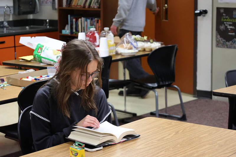 A student reads a book