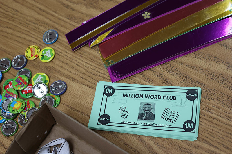 Picture of pretend money with the words: "Million word club"
