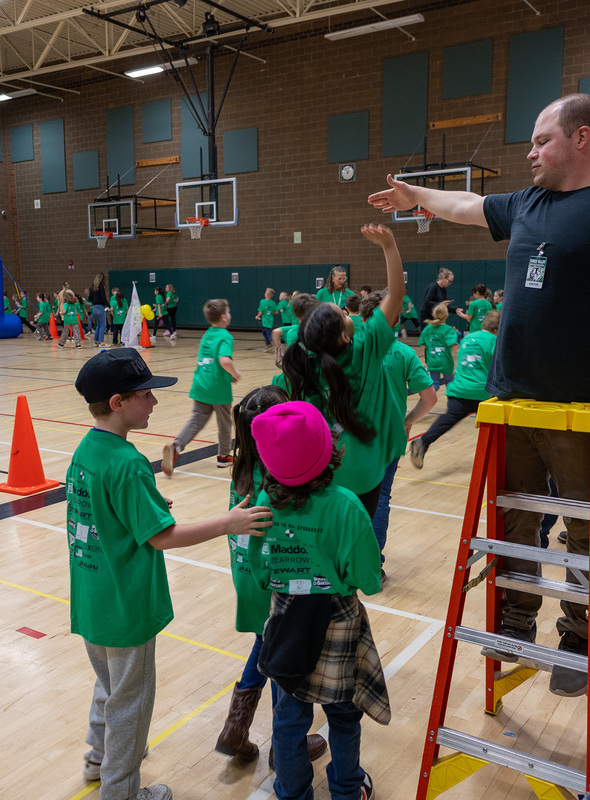 students giving high-fives