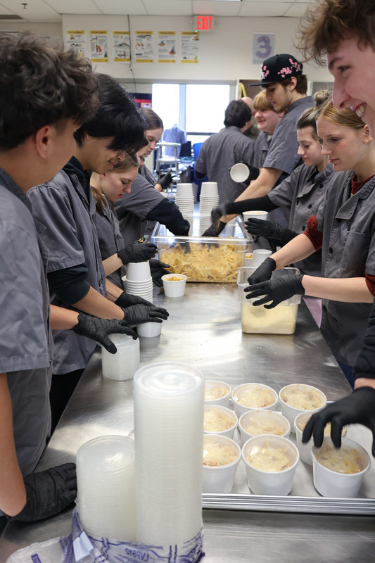 culinary students prepare dishes