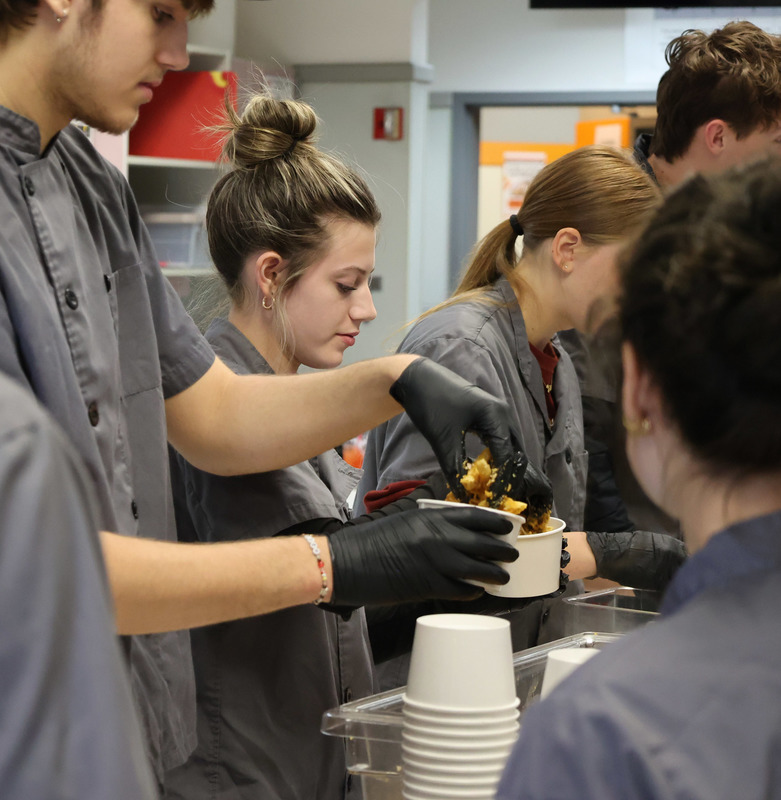 culinary students prepare dishes