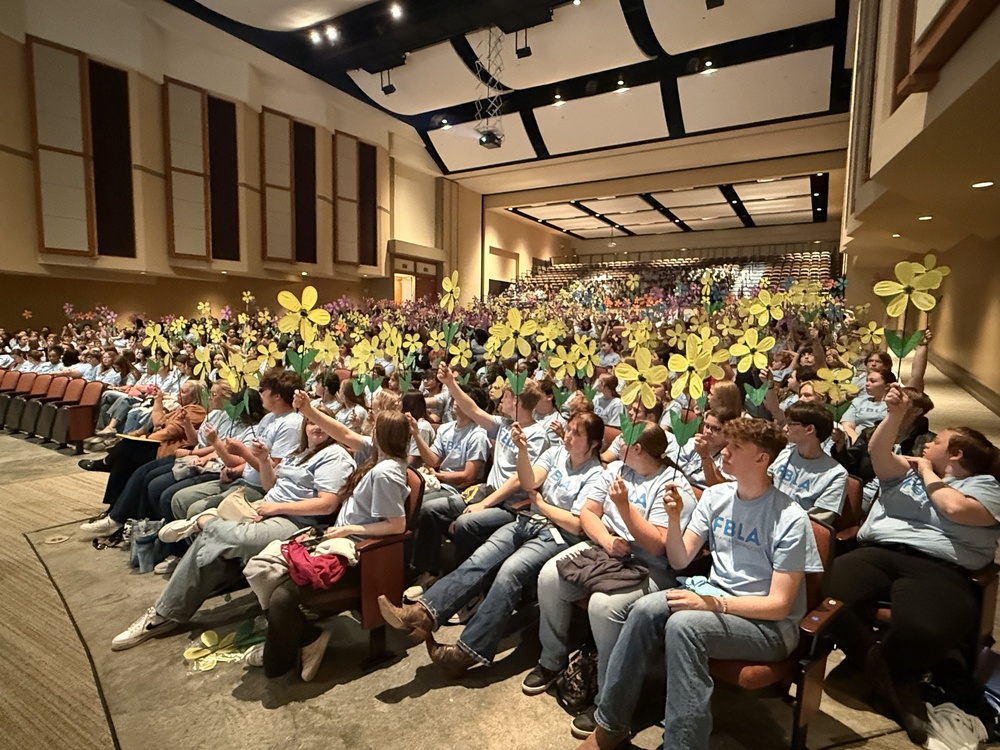 Students holding flowers
