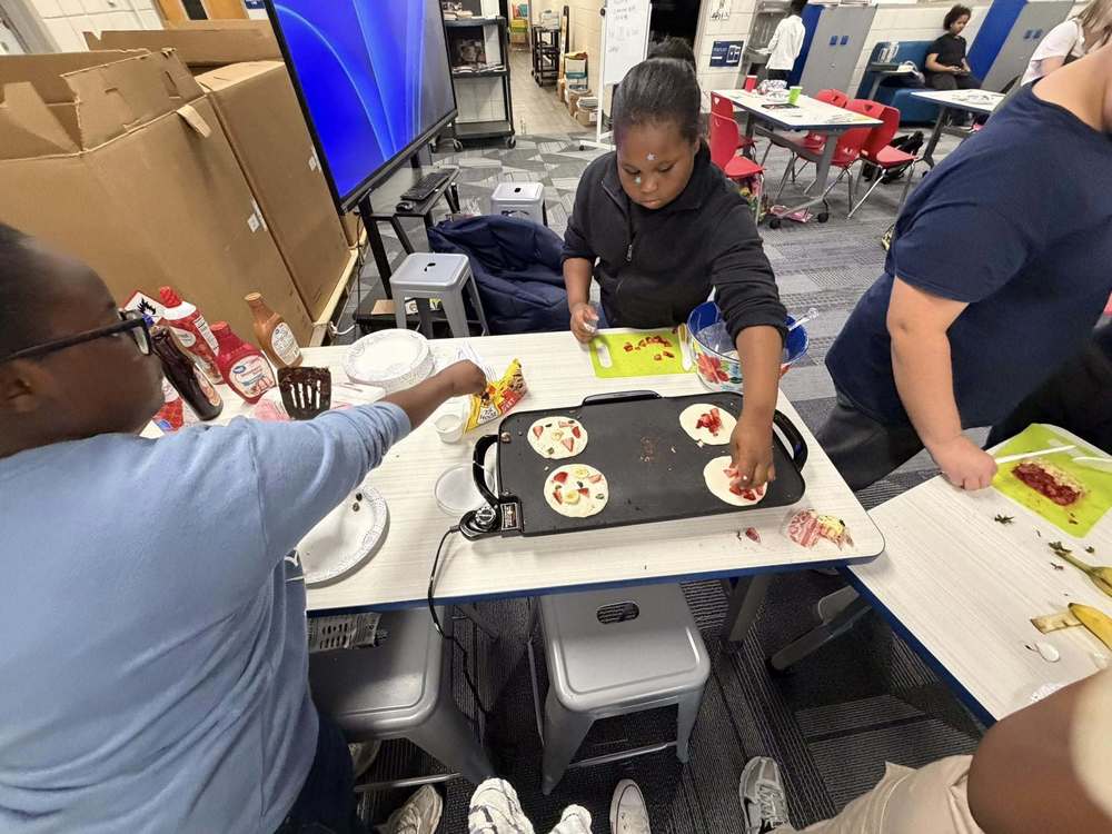 Students making pancakes 
