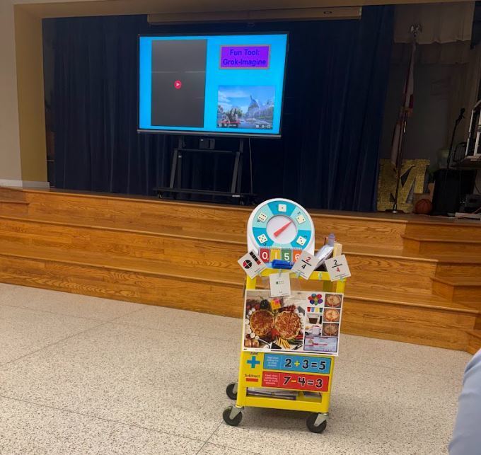A cart displays visual supports and hands-on learning materials, including picture cards and math tools used during the parent session.