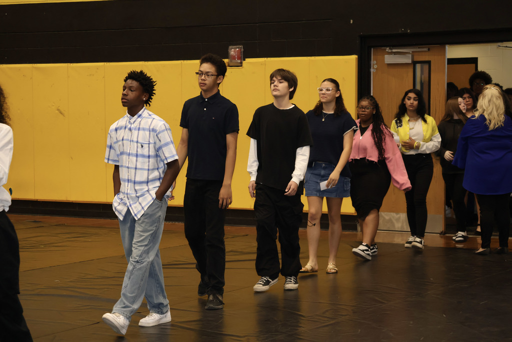 8th grade students process in to the tune of "Pomp & Circumstance" for graduation