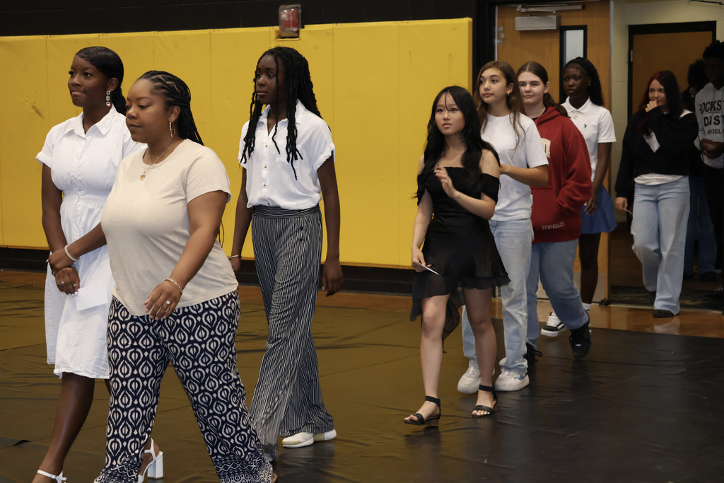8th grade students process in to the tune of "Pomp & Circumstance" for graduation