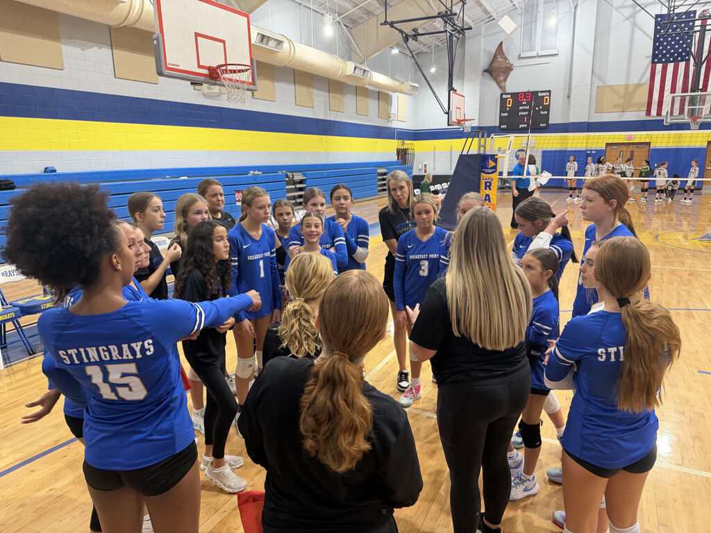 The BPA Lady Rays huddle before their set against Jinks Middle Schools