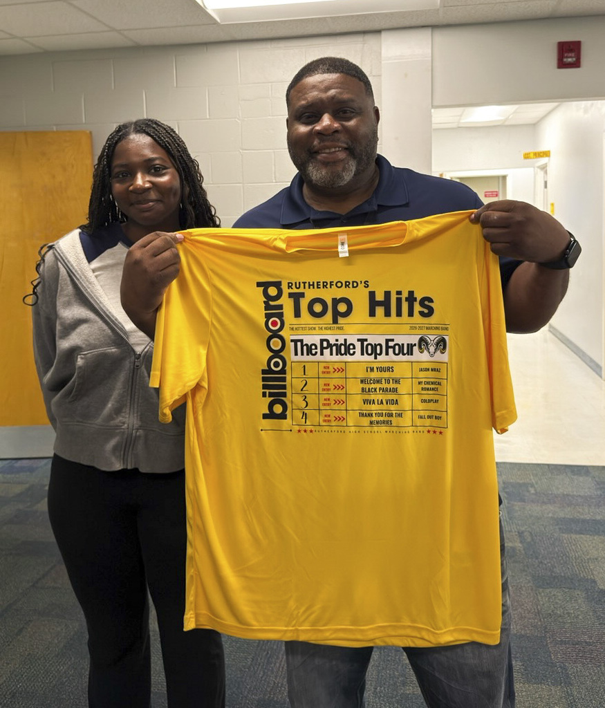 Mr. McKay receives a shirt from The Pride