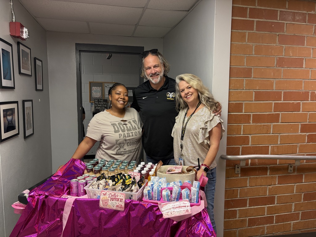 Ms. Myatt, Mr. McQuagge and Mrs. Messer with the Dolly Snack Cart