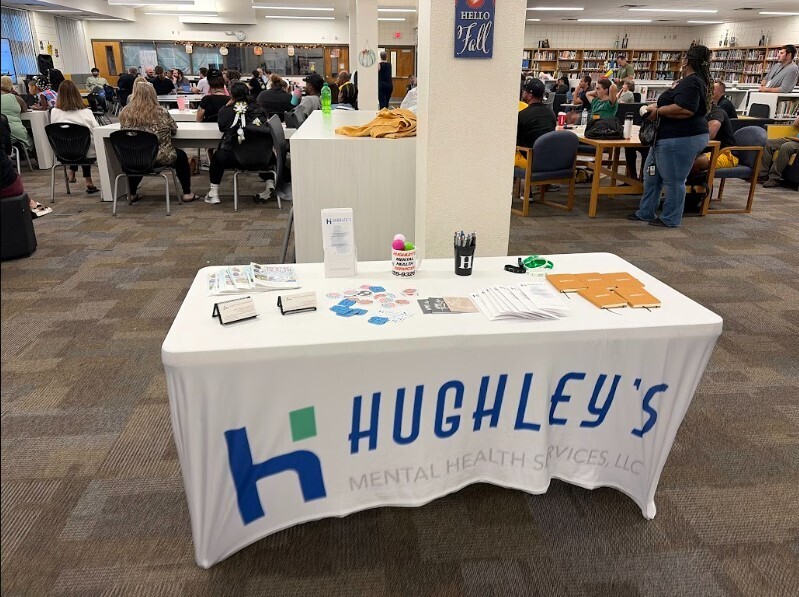 Table set up with info about Hughley's Mental Health Services