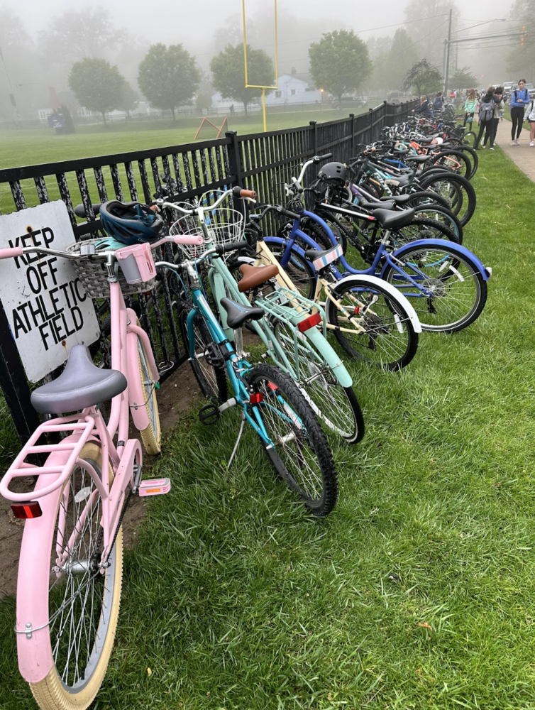Bike to School Challenge photo from May 2025 showing many bikes against a black fence at Bay Middle School.