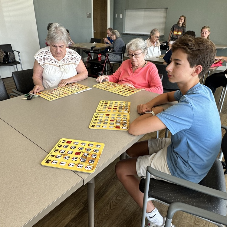 Bay High school key club members volunteering to do bingo at the Knickerbocker Apartments photo