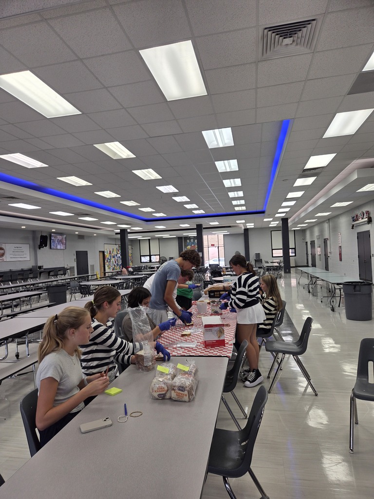 Key Club Members prepare PB & J sandwiches for the Cleveland homeless. 