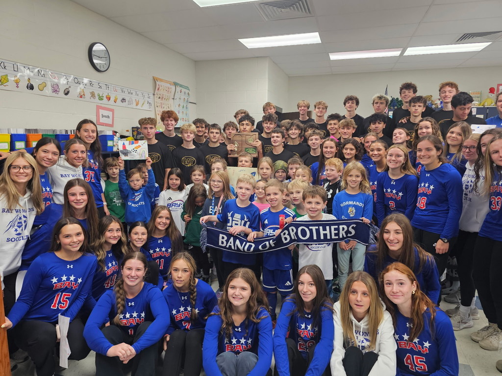 girls and boys soccer teams visit mrs. hart's second-grade class before state send-off