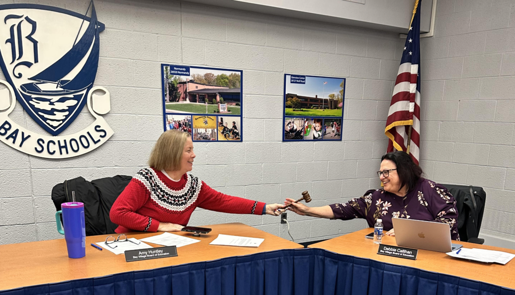 passing the president's gavel to debbie callihan is amy huntley, outgoing president photo