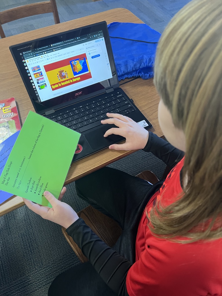 a westerly fourth-grader works on her spanish project about spain