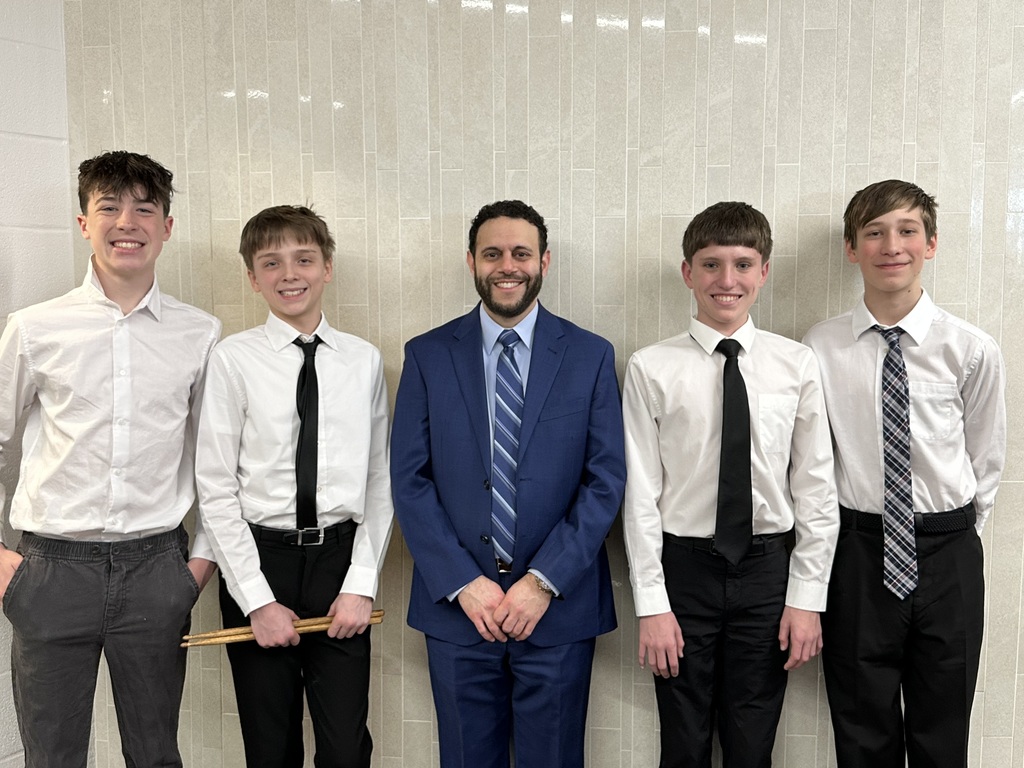 bay middle school band students with teacher Mr. Awad at March 2026 OMEA events