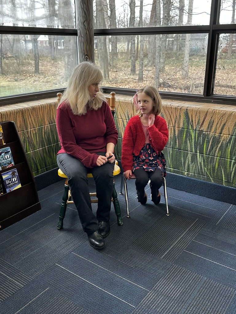 big foot little foot author ellen potter meets a normandy elementary school student during a book signing event
