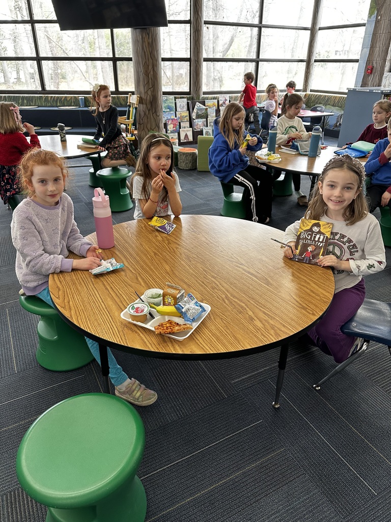 normandy elementary school students eat lunch waiting to meet author ellen potter