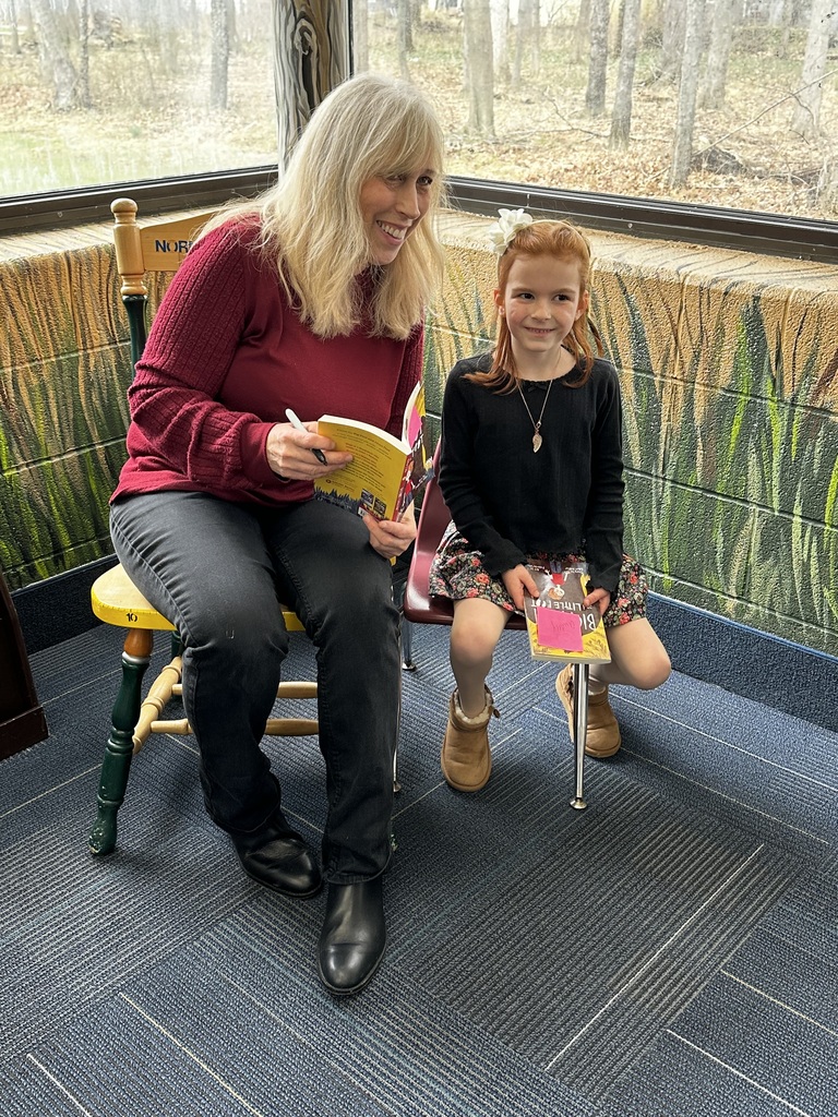 big foot little foot author ellen potter meets a normandy elementary school student during a book signing event
