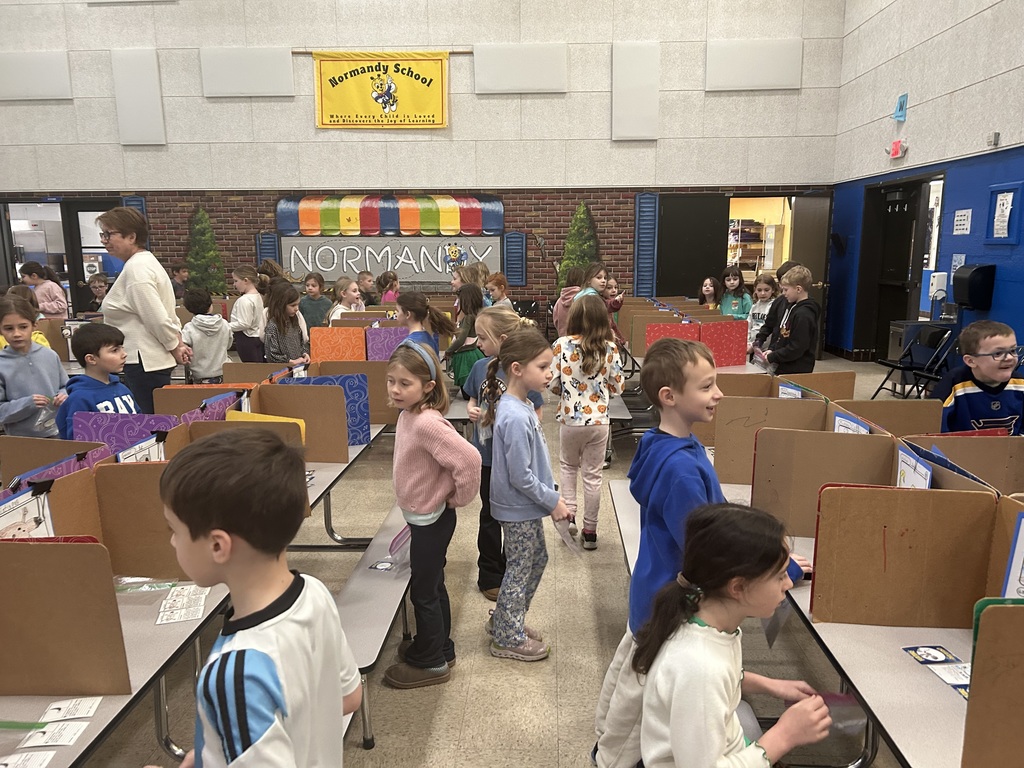 first-graders are pictured during a trading card expo research project