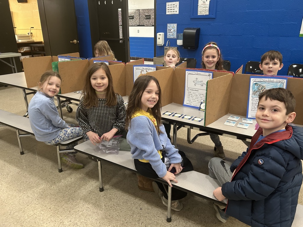 first-graders are pictured during a trading card expo research project