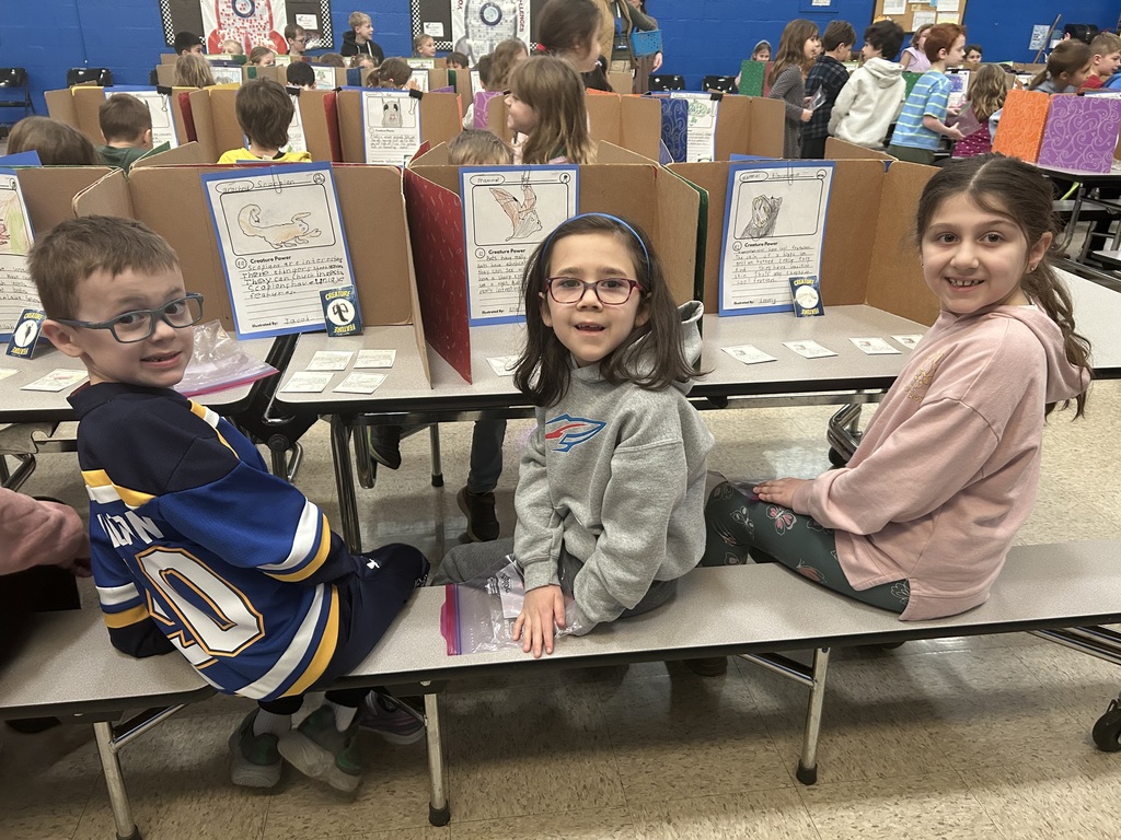 first-graders are pictured during a trading card expo research project