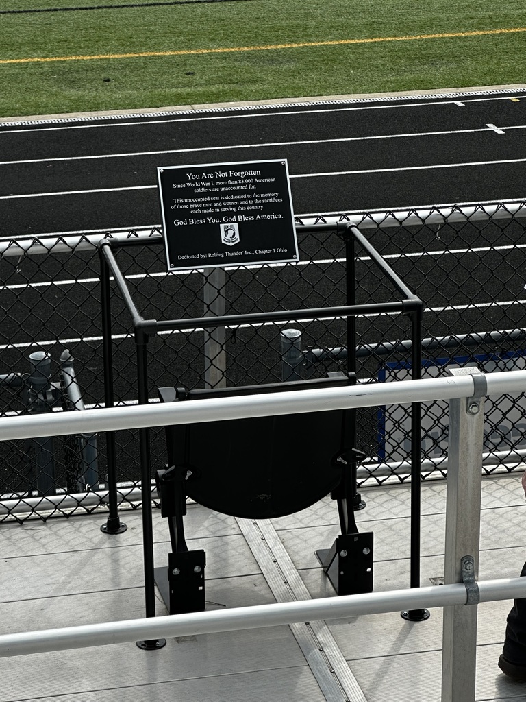 The POW/MIA Honor Chair at Bay Memorial Stadium is pictured. It's black with a sign around it.
