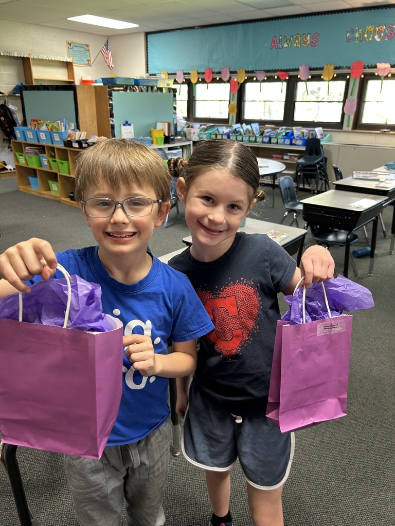 Military Connected students holding purple goody bags in April 2026.