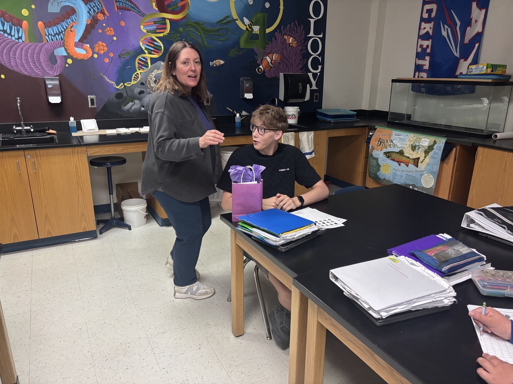 Bay High School military-connected student with their teacher and a purple goody bag.