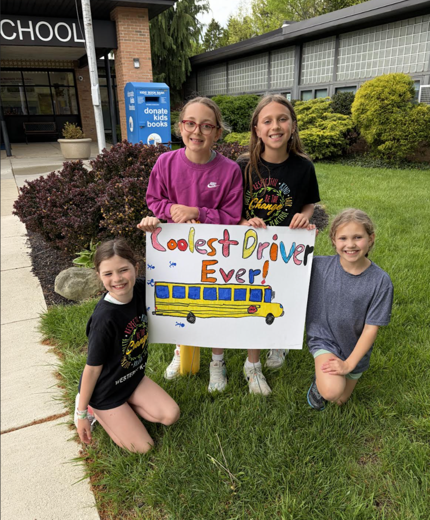 School Bus Driver Appreciation Day 2026 with students holding a handmade poster.