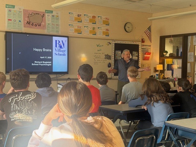 School Psych talks to 8th grade students about happy brains.
