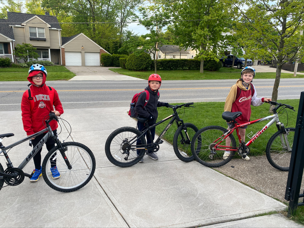 Westerly Bike to School Challenge photo with three fourth-grade boys with helmets and their bikes, May 2026.