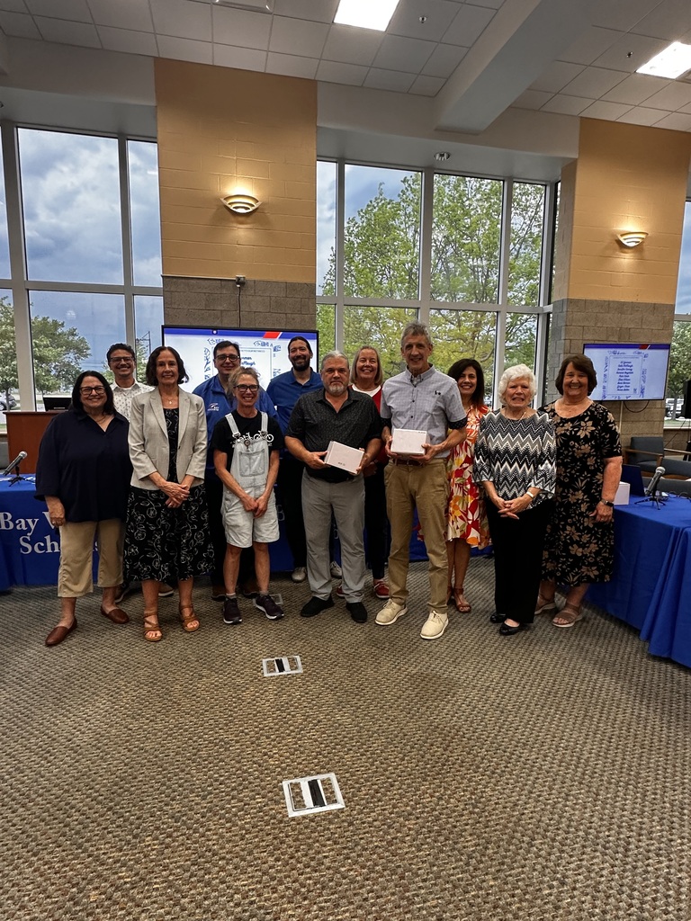 A photo of the district's 2026 retirees with the Board of Education at Bay Middle School.
