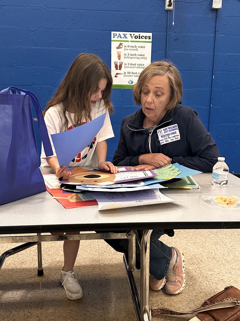 Portfolio Day at Normandy School with students and their families going over their body of work.