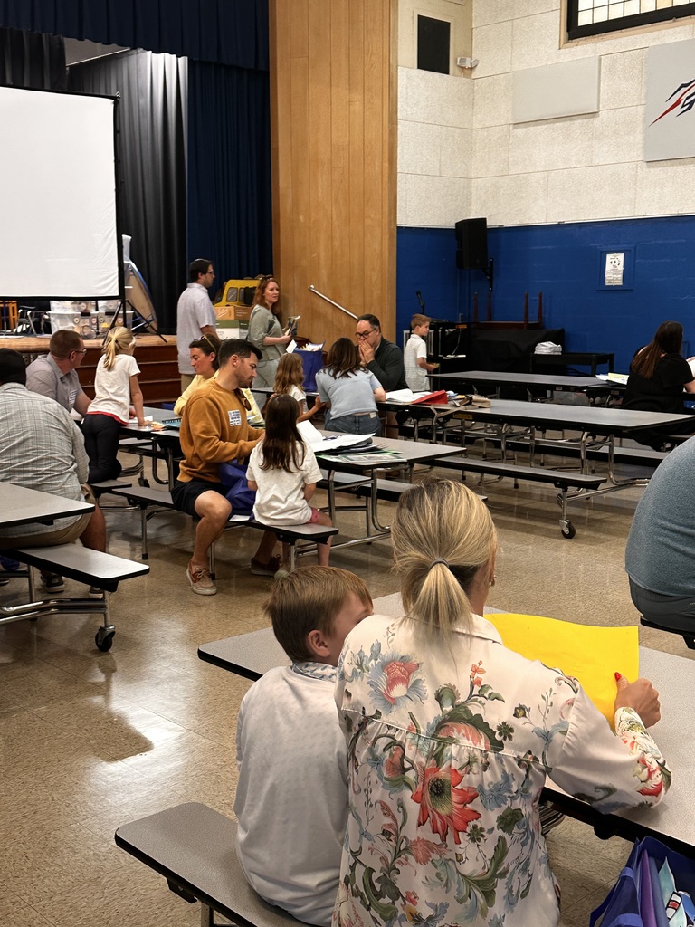 Portfolio Day at Normandy School with students and their families going over their body of work.