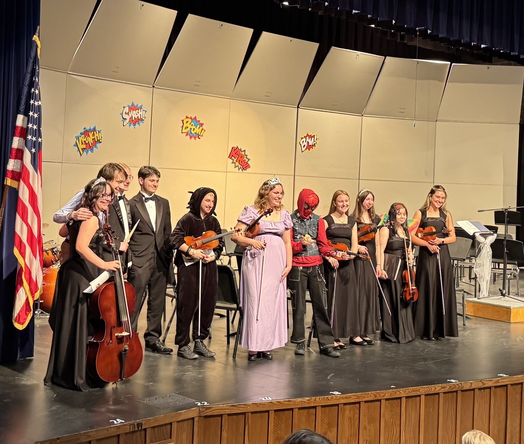 Senior orchestra students on stage for the princess and super hero event in May 2026.