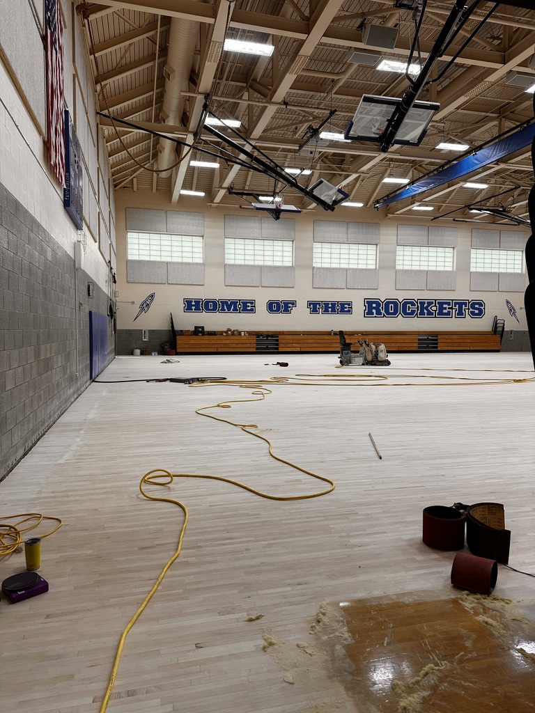 Bay Middle School gym receiving a complete floor refinish, pictured during the sanding stage. 