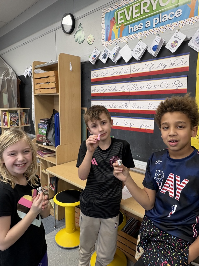 glenview third-grade aftercare photo of students solving a puzzle to earn prizes