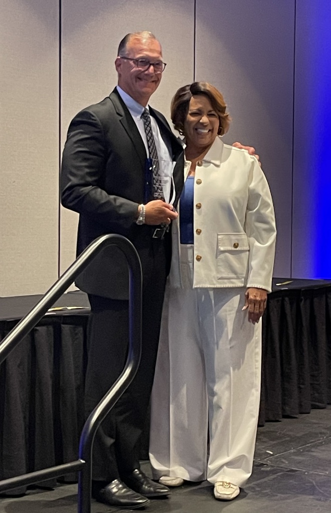 Scot Prebles, superintendent, with the leader of the Martha Holden Jennings Foundation.