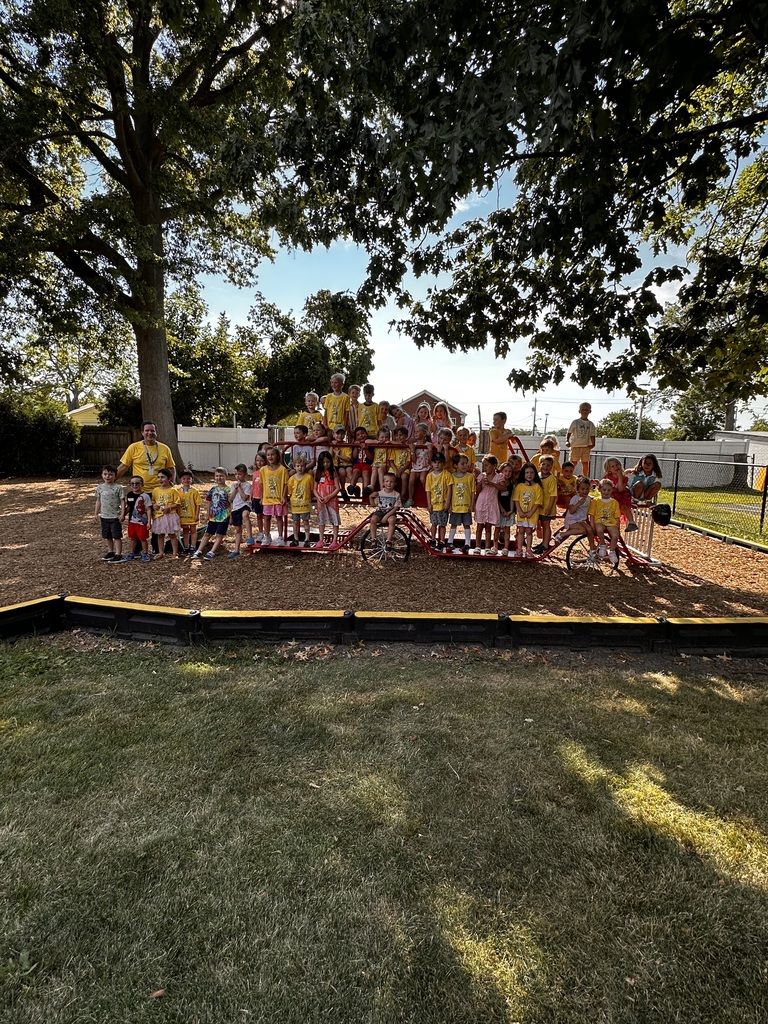 Principal Dan Sebring on the playground with new kindergarten students.