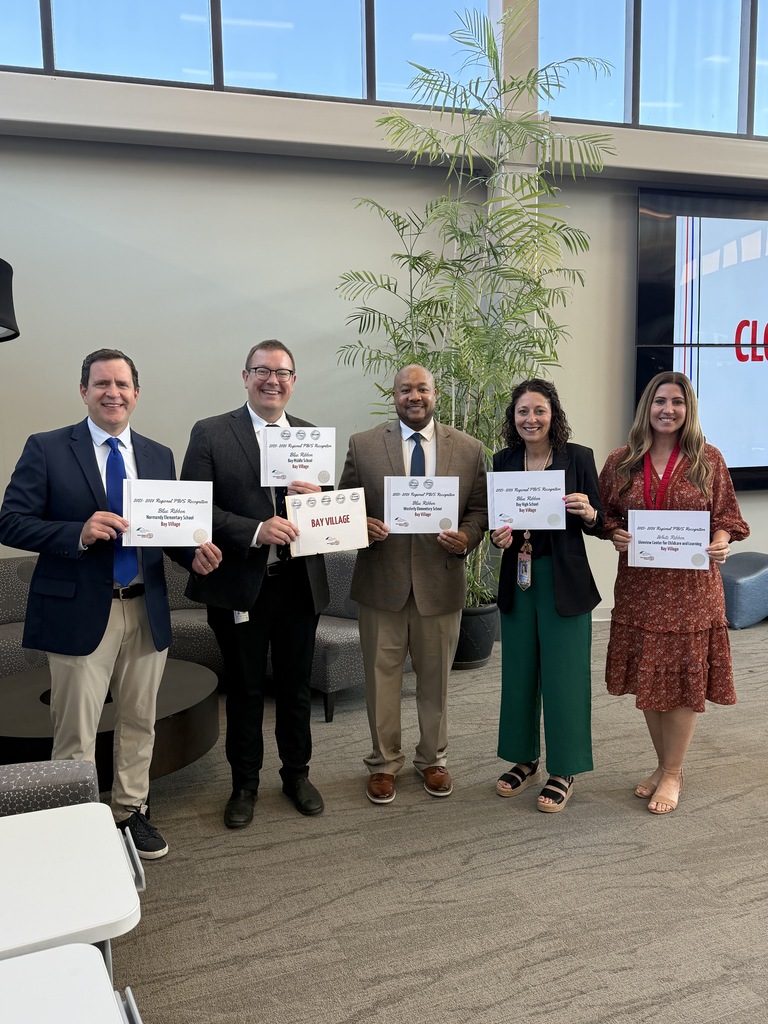 Five Bay Village School District administrators and teachers holding up certificates that honor their buildings' PBIS work.