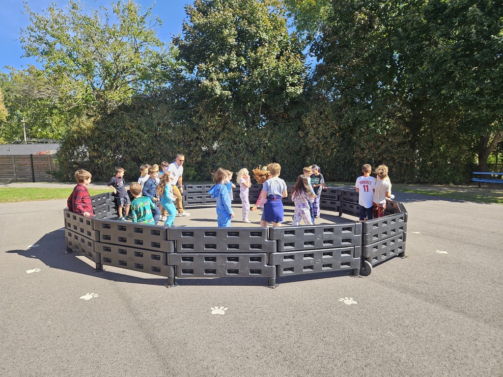 Elementary students playing Gaga ball on the playground.