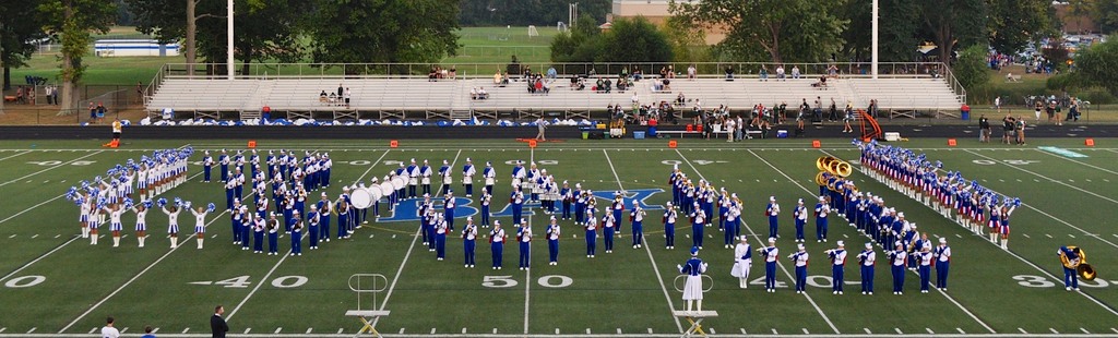 BMS Marxhing band photo with band members on the football field.