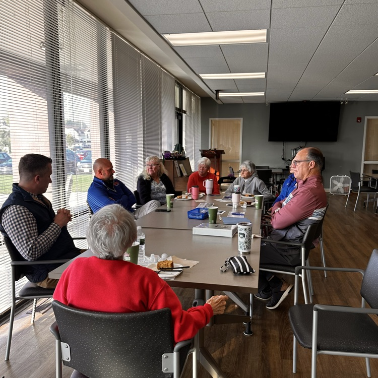 knickerbocker seniors seated at a table answering questions
