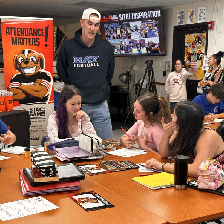Rex sunahara with bay high school students in a classroom