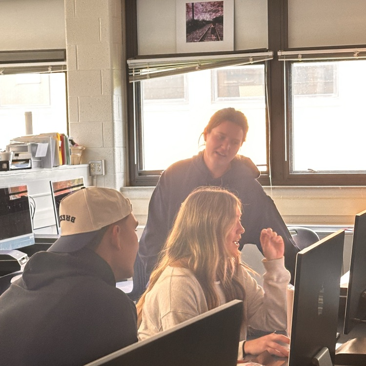 Rex sunahara with bay high school students in a classroom
