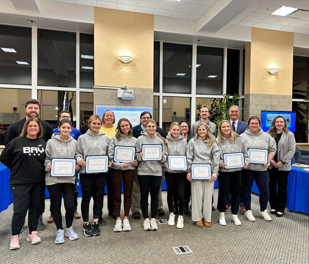 girls soccer team at board meeting