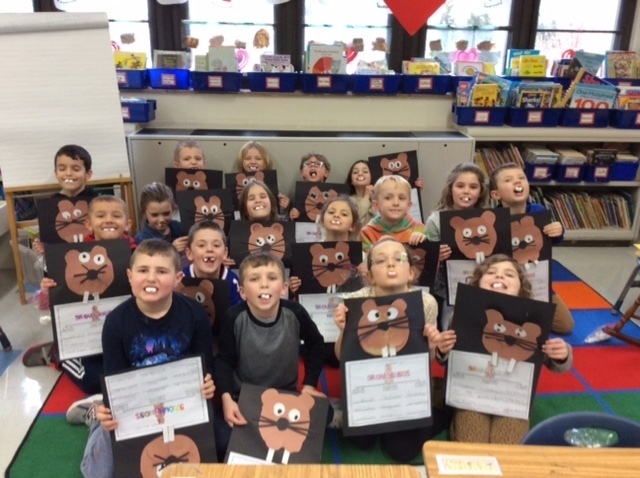 Groundhog Day fun photo with Mrs. Hack's first-grade class.